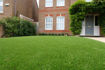 Lido Plus 30mm artificial grass installed in a residential garden, providing a lush, maintenance-free lawn suitable for children and pets