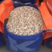 Dumpy bag filled with Dorset flint gravel ready for delivery to a landscaping site