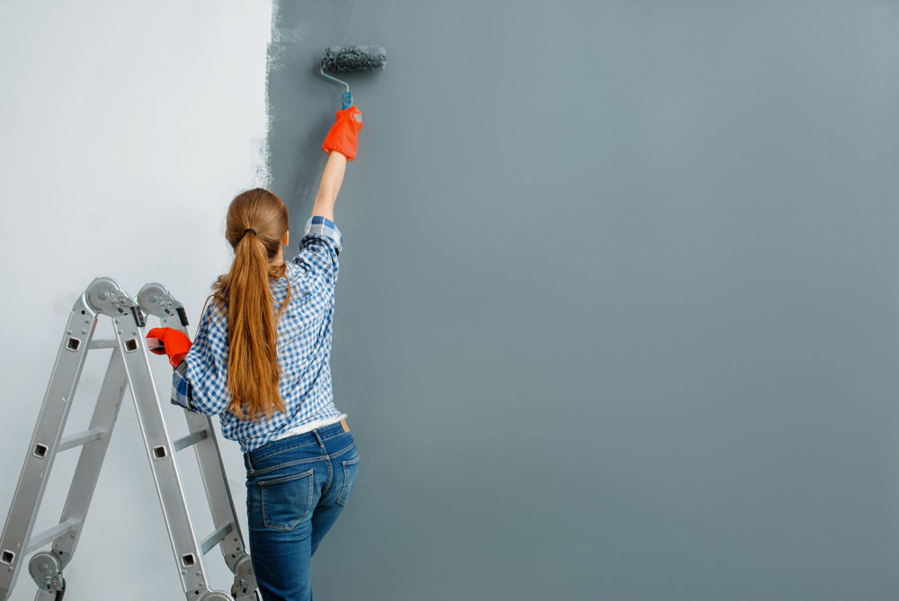 Women decorating the wall